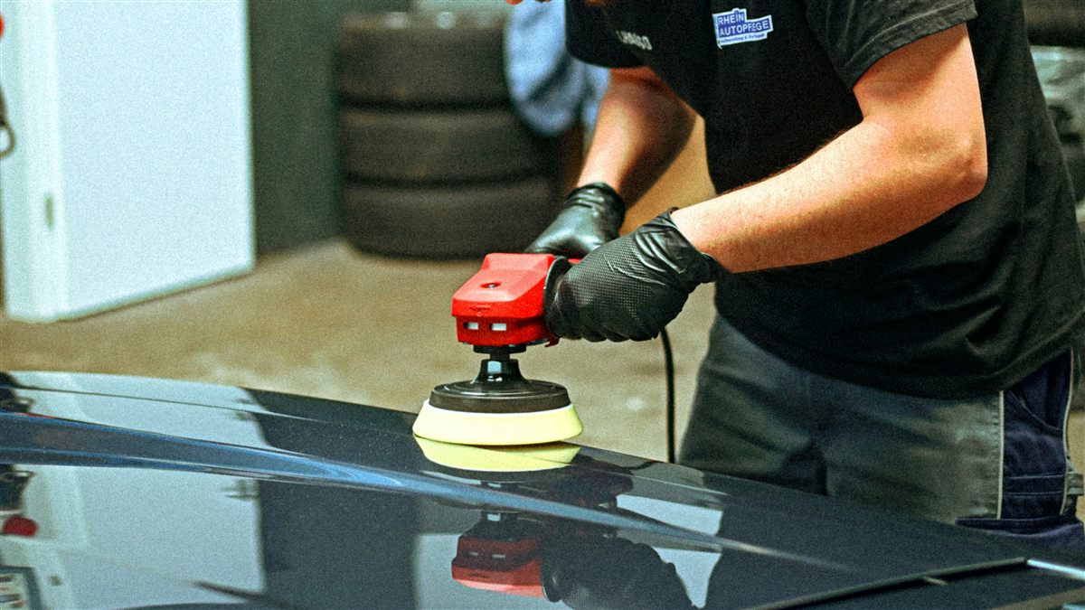 Orbital polisher applied to dark paint panel — Diamond Lux paint correction